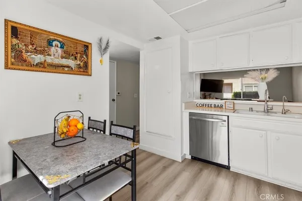 a view of a livingroom with furniture and wooden floor