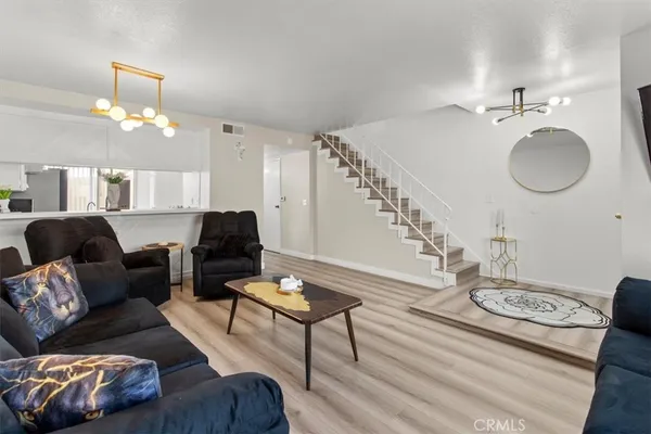 a backyard of a house with barbeque oven table and chairs