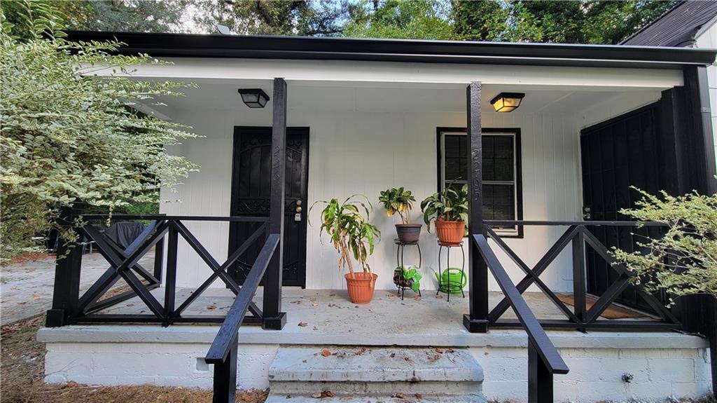 2267 Rugby Terrace Atlanta, GA 30337 - Photo 1 of 19 a front view of a house with garden
