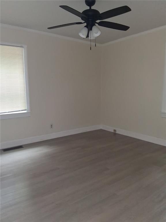 2267 Rugby Terrace Atlanta, GA 30337 - Photo 11 of 19 an empty room with a window and a fan