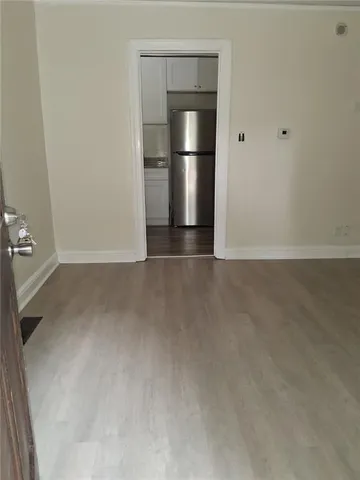 a view of room with ceiling fan and window