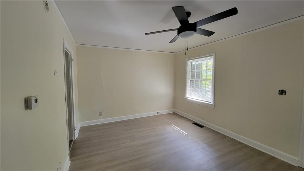 2267 Rugby Terrace Atlanta, GA 30337 - Photo 14 of 19 a view of room with ceiling fan and window