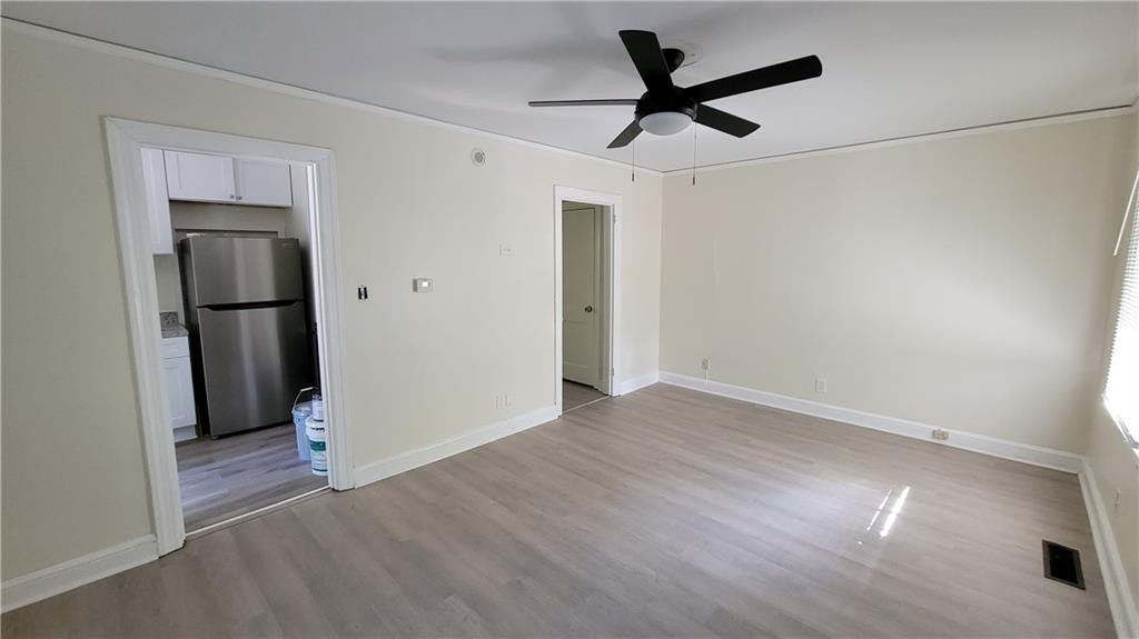 2267 Rugby Terrace Atlanta, GA 30337 - Photo 15 of 19 a view of empty room with wooden floor and ceiling fan
