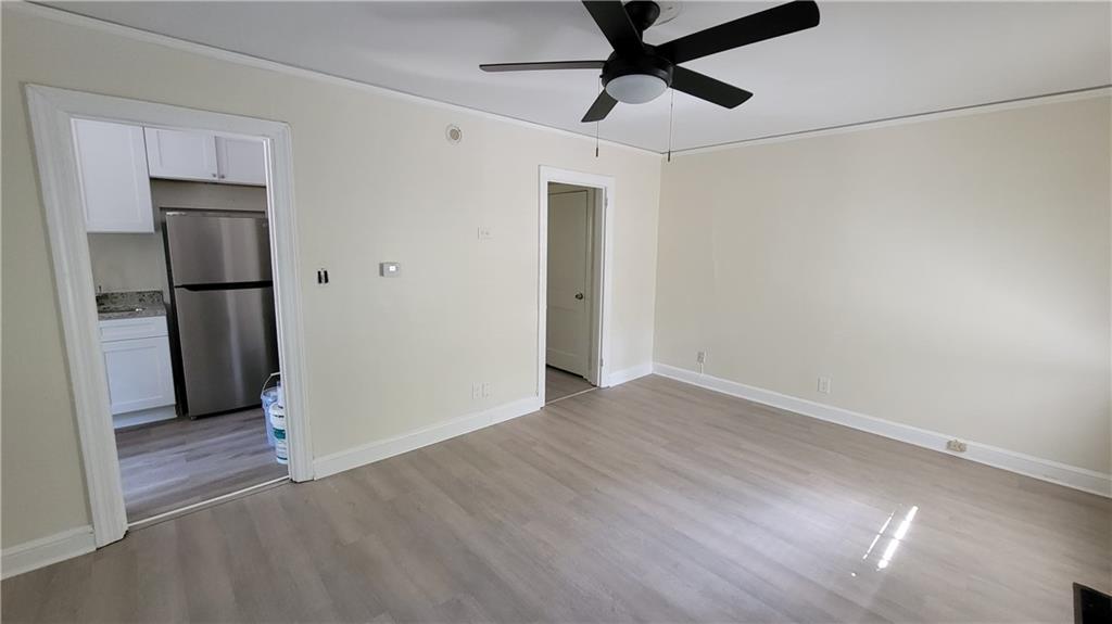 2267 Rugby Terrace Atlanta, GA 30337 - Photo 18 of 19 a view of empty room with wooden floor