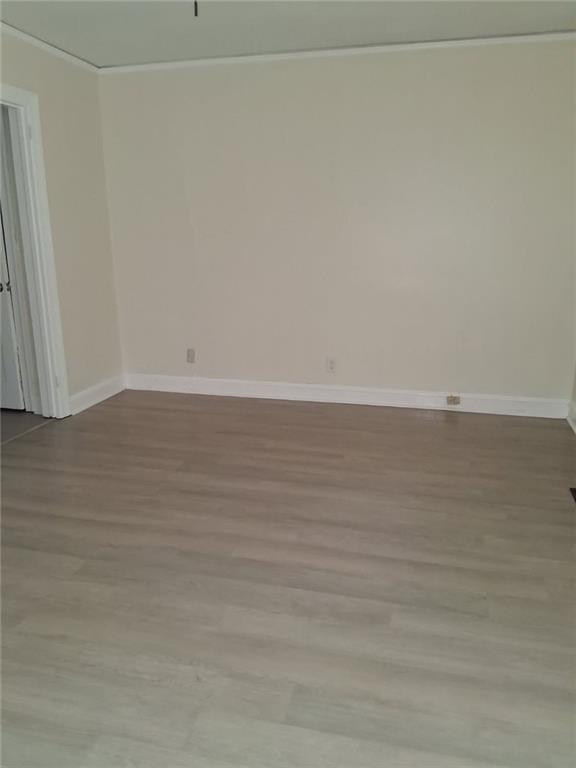 2267 Rugby Terrace Atlanta, GA 30337 - Photo 6 of 19 a view of an empty room and wooden floor
