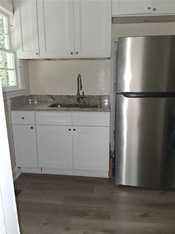 2267 Rugby Terrace Atlanta, GA 30337 - Photo 8 of 19 a kitchen with stainless steel appliances granite countertop a refrigerator sink and cabinets