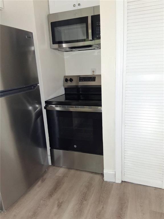 2267 Rugby Terrace Atlanta, GA 30337 - Photo 9 of 19 a view of kitchen and utility room