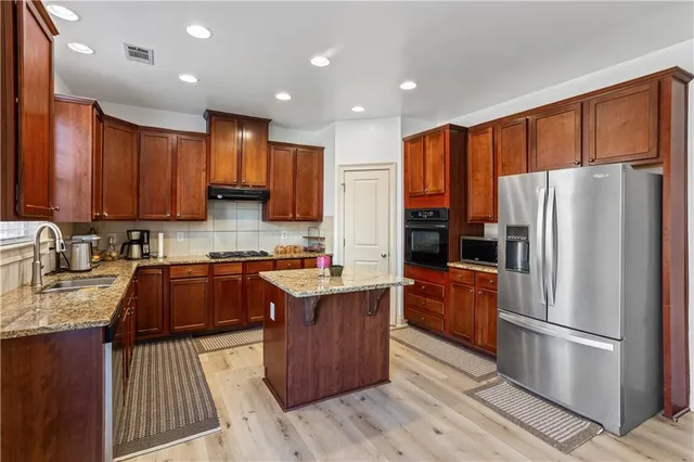 a living room with furniture window and a fireplace