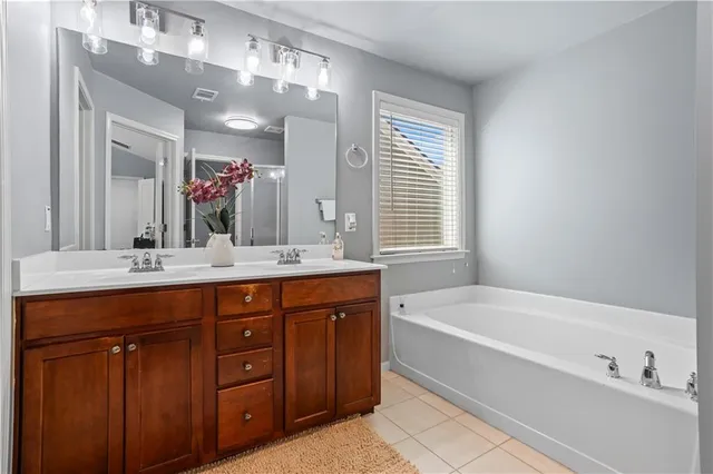 a bedroom with a bed and a desk