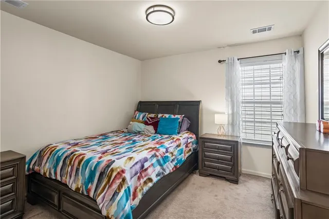 a view of an outdoor swimming pool with seating area