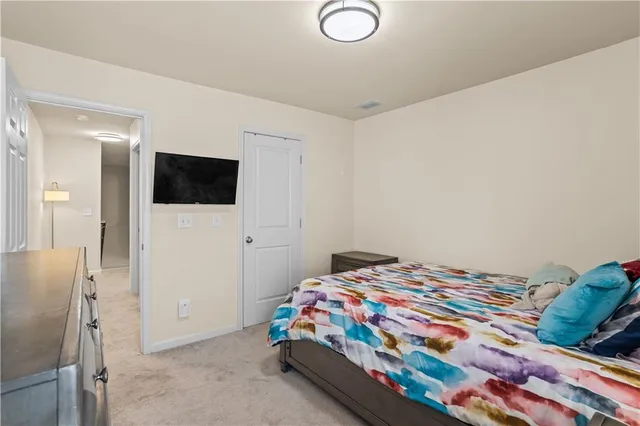 a view of a tennis ground with large trees