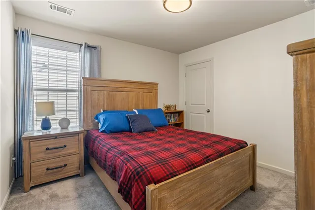 a view of a backyard with a table and chairs