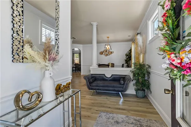 a view of a dining room with furniture window and wooden floor