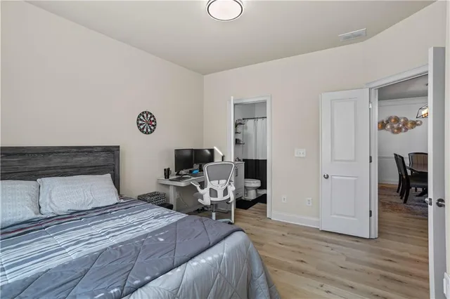 a kitchen with granite countertop a sink stove and cabinets