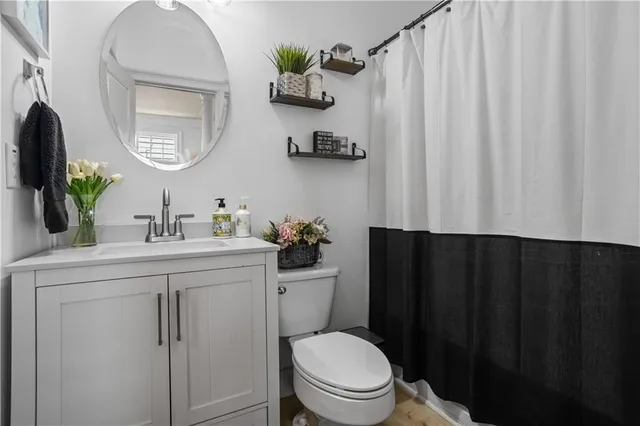 a kitchen with a table chairs sink and cabinets