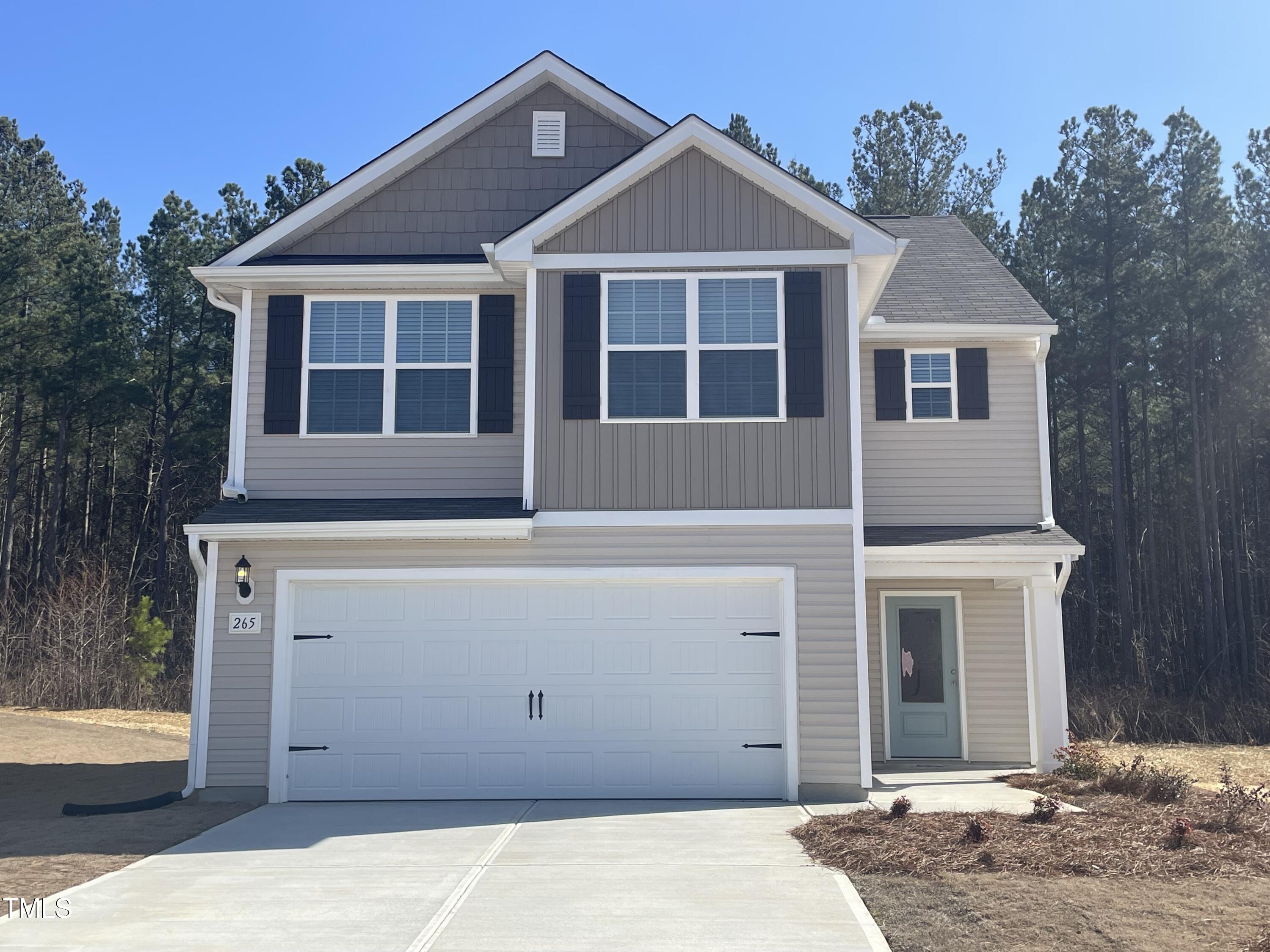 265 Crow Field Street Roxboro, NC 27574 - Photo 1 of 18 a front view of a house with a yard