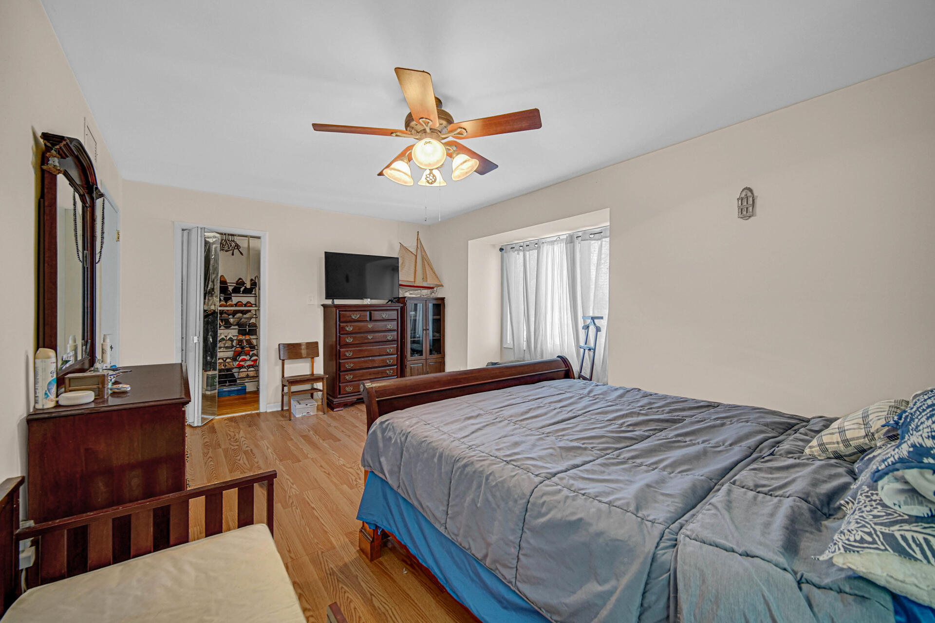 7933 Jefferson Avenue, Unit 4B Munster, IN 46321 - Photo 11 of 20 a bedroom with a bed a dresser and flat screen tv