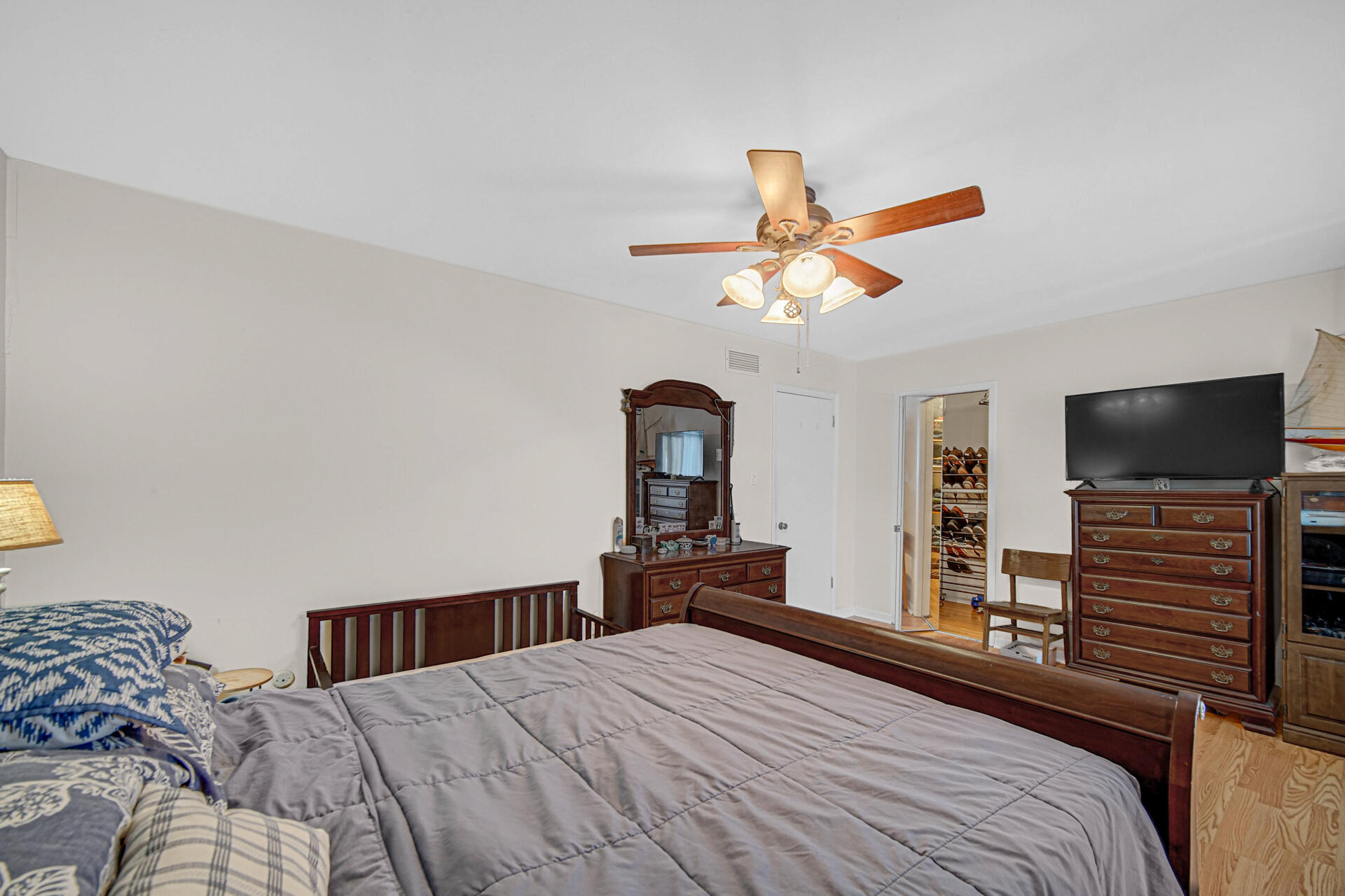 7933 Jefferson Avenue, Unit 4B Munster, IN 46321 - Photo 13 of 20 a bedroom with a bed and a flat screen tv