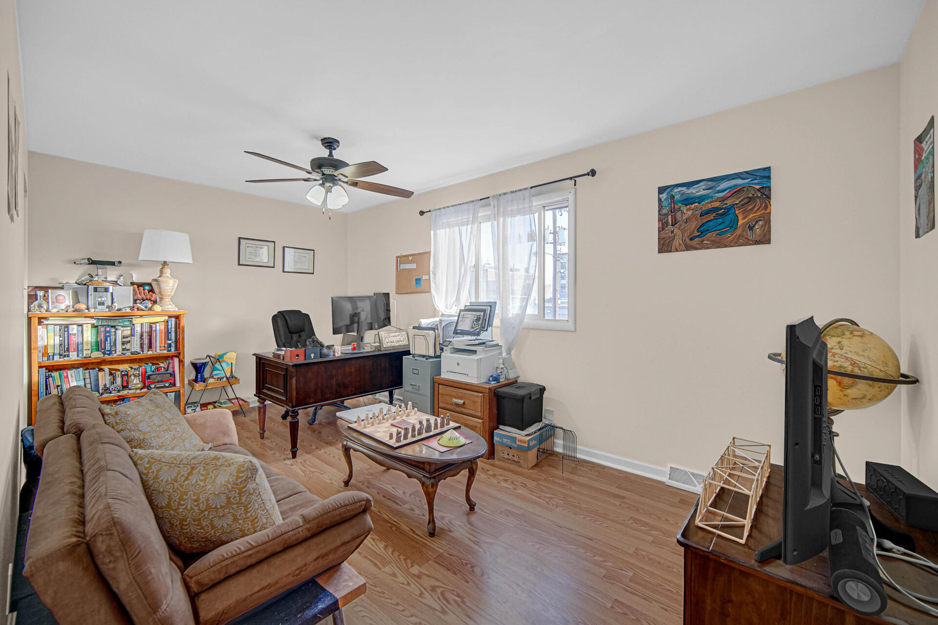 7933 Jefferson Avenue, Unit 4B Munster, IN 46321 - Photo 14 of 20 a living room with furniture a flat screen tv and a window