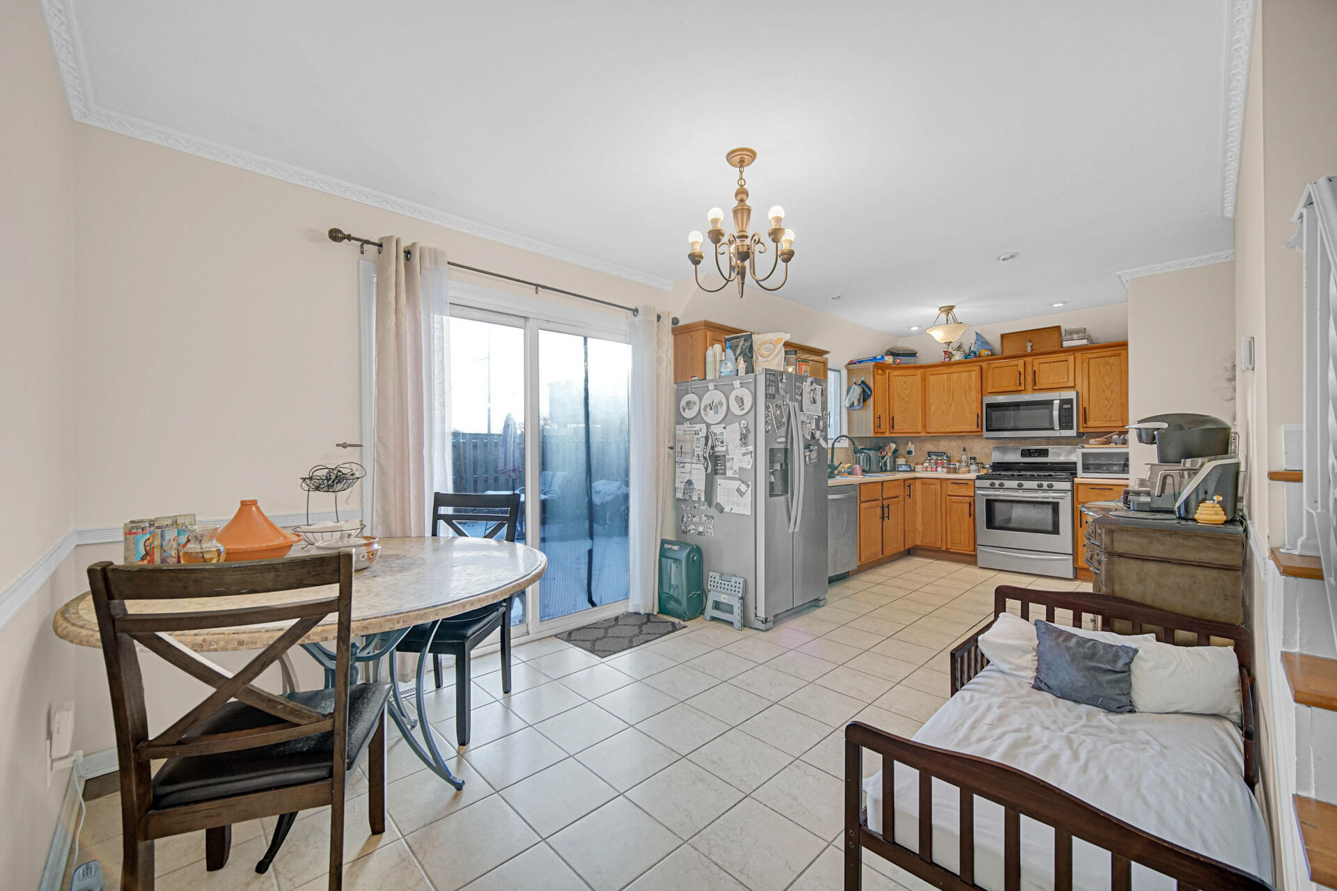 7933 Jefferson Avenue, Unit 4B Munster, IN 46321 - Photo 5 of 20 a view of a dining room with furniture and a chandelier