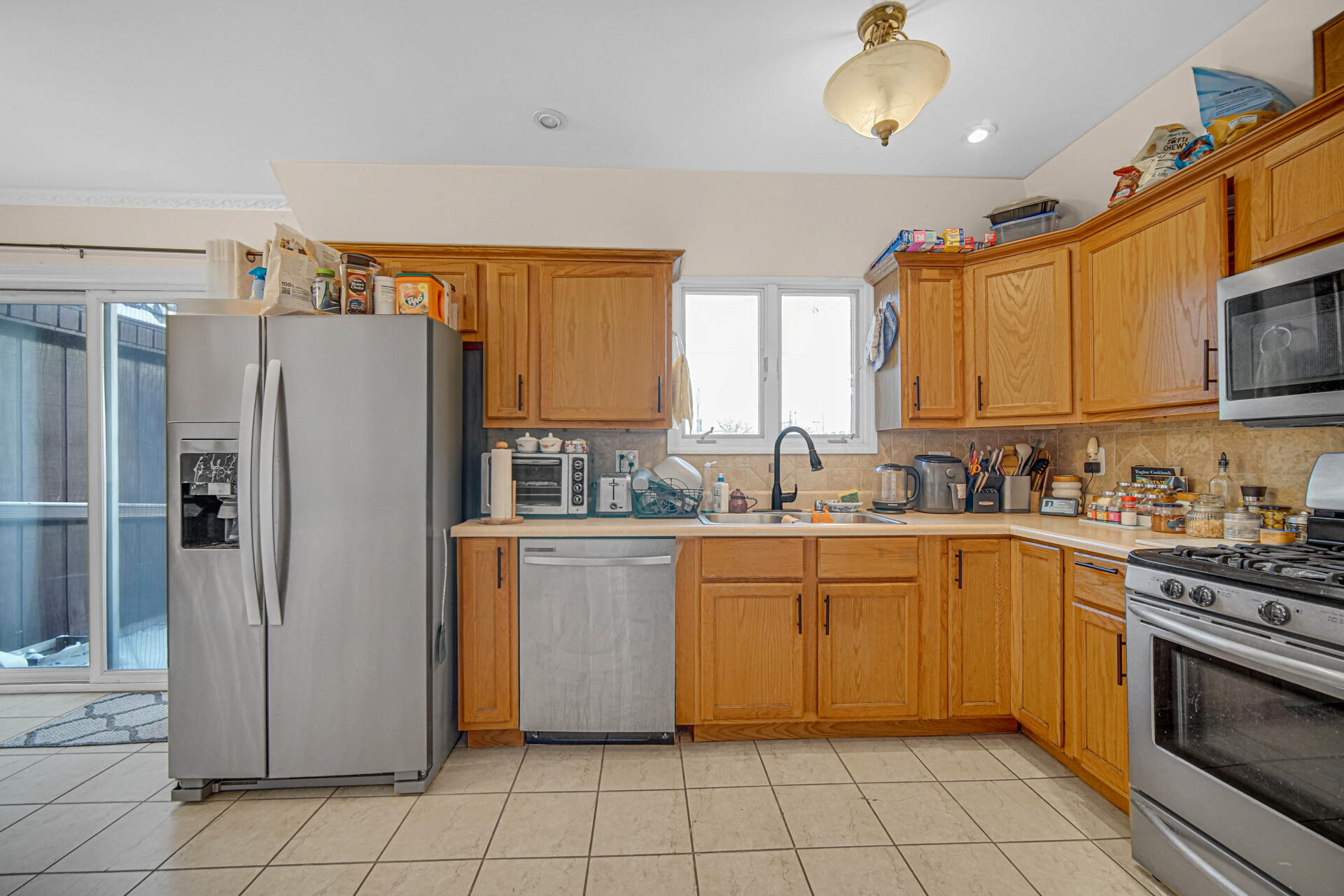 7933 Jefferson Avenue, Unit 4B Munster, IN 46321 - Photo 8 of 20 a kitchen with a stove sink and refrigerator