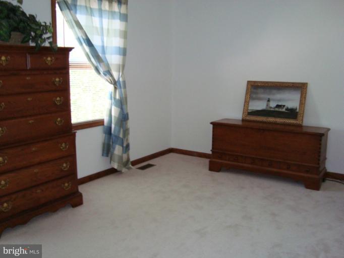 8166 N Road Severn, MD 21144 - Photo 14 of 25 a view of room with cabinet and wooden floor