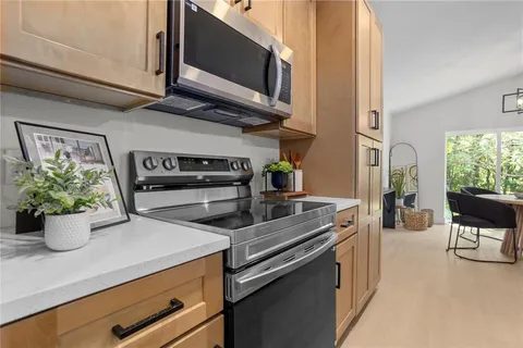 a kitchen with a stove and a microwave