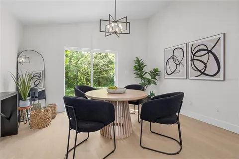 a view of a dining room with furniture window and outside view