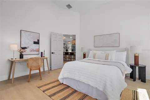 a bedroom with a bed and a chair