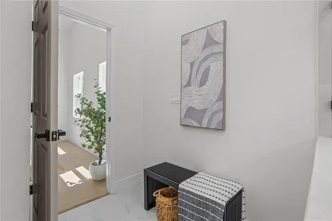 a room with a table and a potted plant