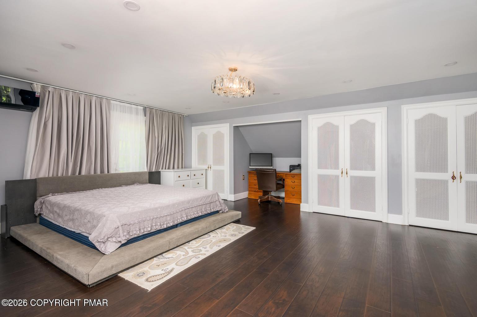 720 Stokes Mill Road East Stroudsburg, PA 18301 - Photo 35 of 87 a spacious bedroom with a bed and window