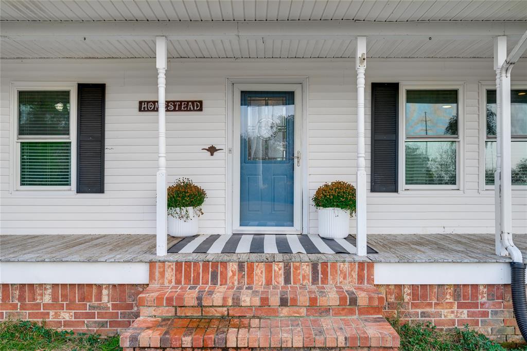 435 County Road 3204 Quitman, TX 75783 - Photo 12 of 36 Warm and welcoming entry, with wrap around porch
