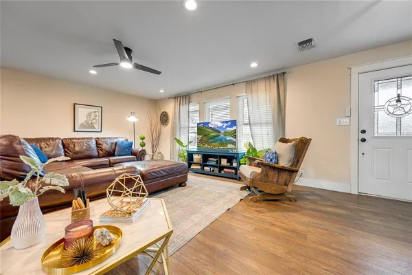 a living room with furniture and a large window