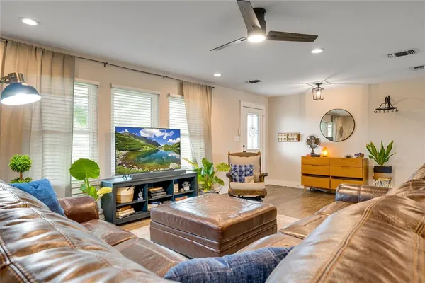 a view of a dining room with furniture window and wooden floor