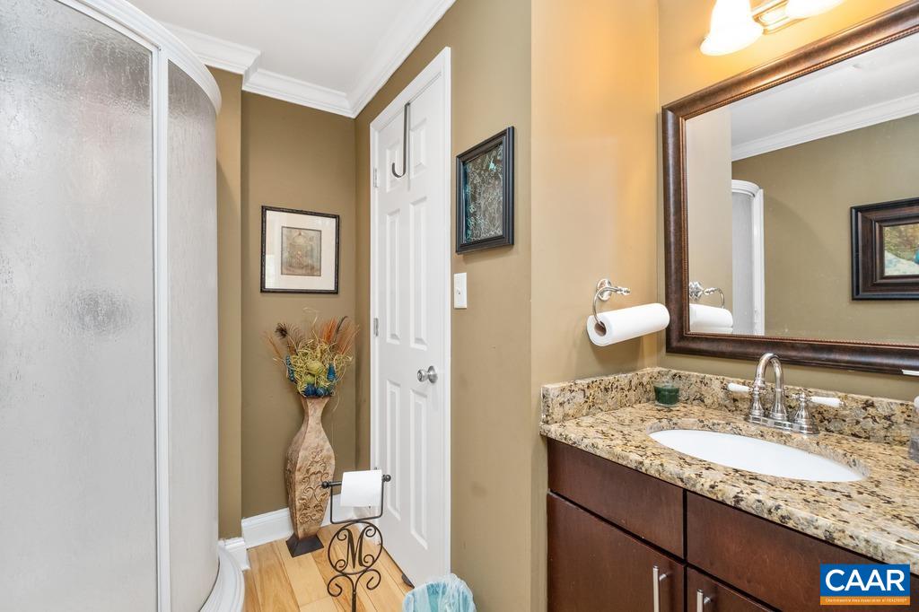 2765 Gelletly Road Charlottesville, VA 22902 - Photo 24 of 42 a bathroom with a granite countertop sink and a mirror