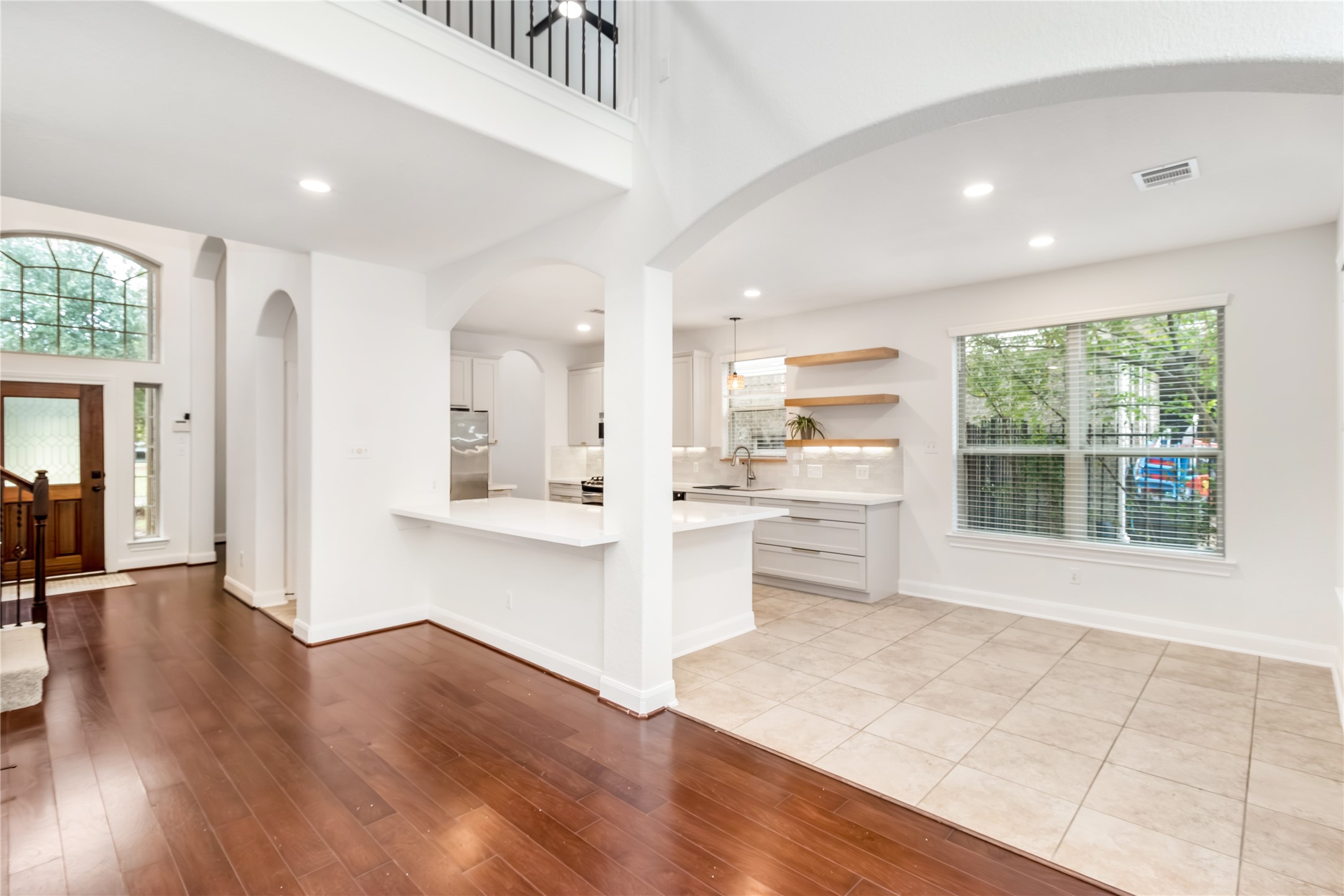 142 Pinto Point Place Spring, TX 77389 - Photo 21 of 36 a view of a kitchen with wooden floor and a window