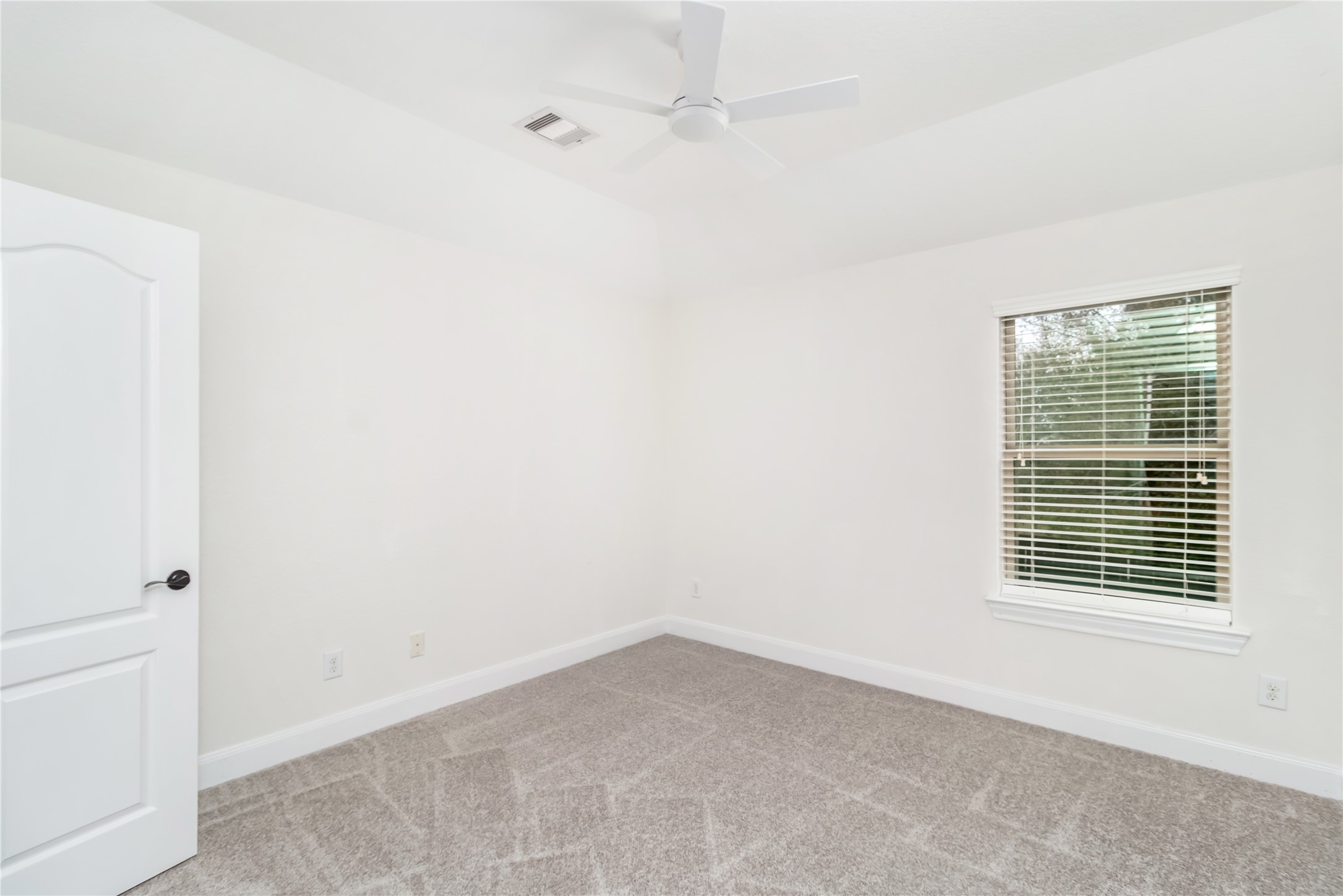 142 Pinto Point Place Spring, TX 77389 - Photo 23 of 36 a view of an empty room with a window