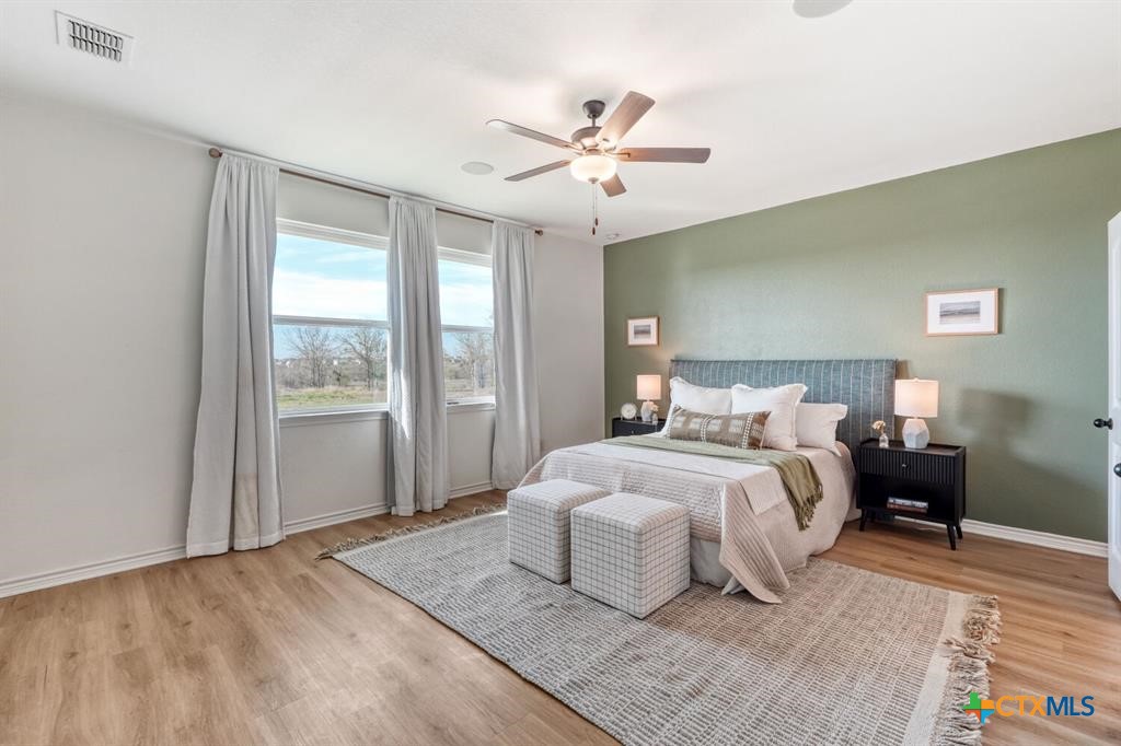 1642 Scull Road San Marcos, TX 78666 - Photo 14 of 31 Spacious primary bedroom with peaceful surroundings.
