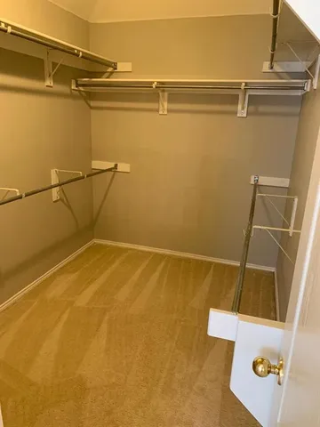 a view of a room with racks on the wall