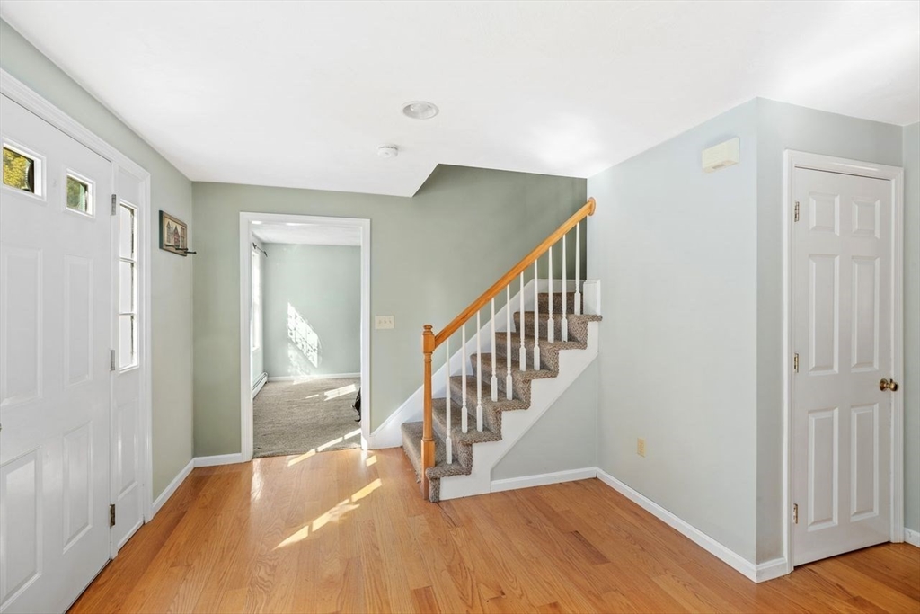 102 Haskell Ridge Road Rochester, MA 02770 - Photo 14 of 36 a view of a hallway with wooden floor and entryway