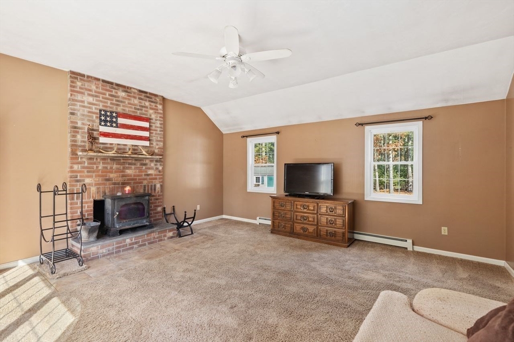 102 Haskell Ridge Road Rochester, MA 02770 - Photo 16 of 36 a living room with furniture and a flat screen tv
