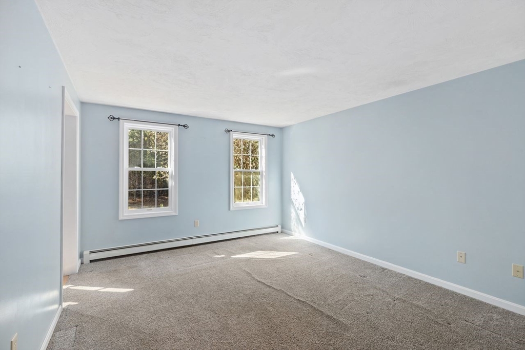 102 Haskell Ridge Road Rochester, MA 02770 - Photo 19 of 36 an empty room with windows