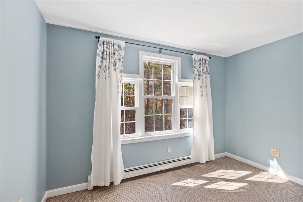 102 Haskell Ridge Road Rochester, MA 02770 - Photo 20 of 36 a view of an empty room with a window