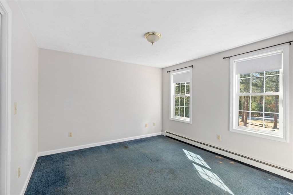 102 Haskell Ridge Road Rochester, MA 02770 - Photo 22 of 36 a view of an empty room with a window