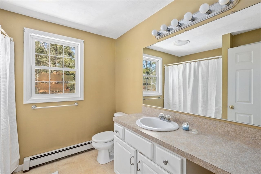 102 Haskell Ridge Road Rochester, MA 02770 - Photo 24 of 36 a bathroom with a granite countertop sink toilet and mirror