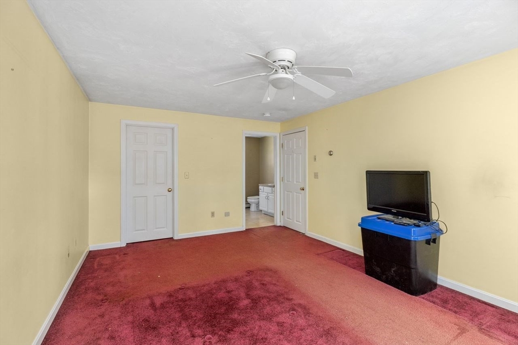 102 Haskell Ridge Road Rochester, MA 02770 - Photo 27 of 36 a view of a livingroom with a flat screen tv
