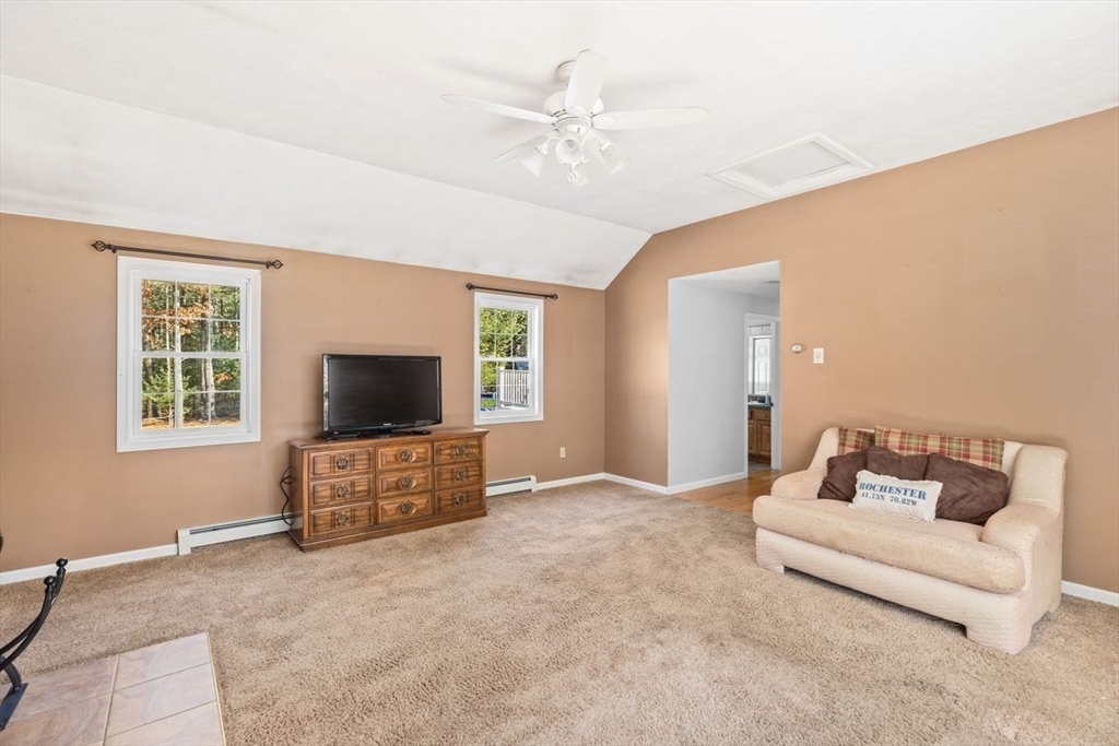 102 Haskell Ridge Road Rochester, MA 02770 - Photo 28 of 36 a living room with furniture and a flat screen tv