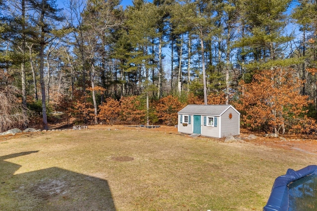 102 Haskell Ridge Road Rochester, MA 02770 - Photo 31 of 36 a front view of a house with a yard