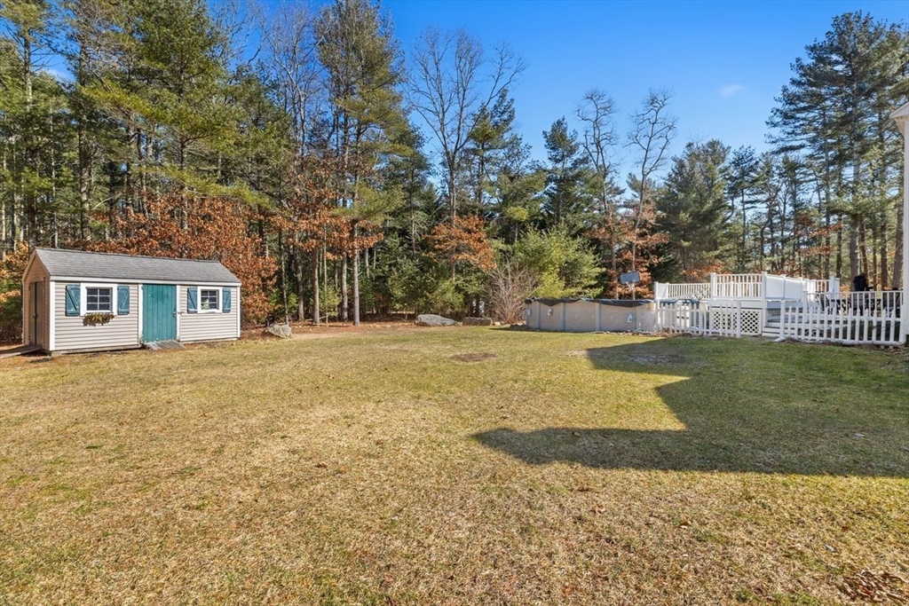102 Haskell Ridge Road Rochester, MA 02770 - Photo 34 of 36 a view of a house with backyard and trees