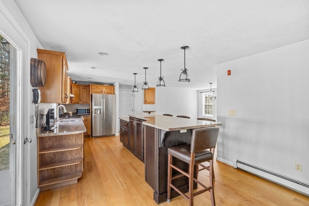 102 Haskell Ridge Road Rochester, MA 02770 - Photo 7 of 36 a view of a kitchen and dining room